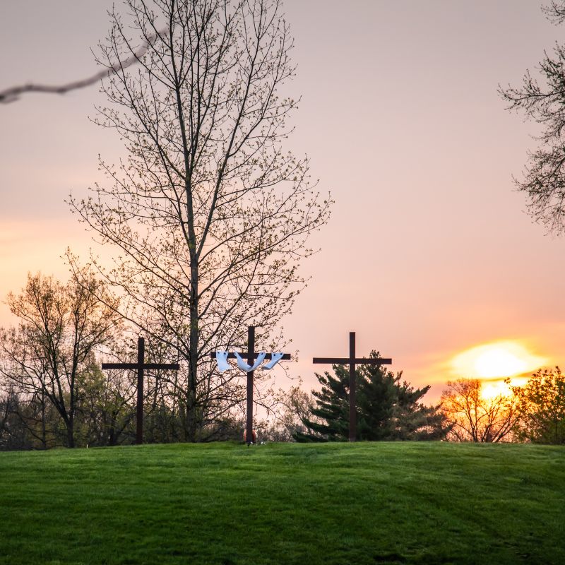 April Photo by Bari Cruz of the sunrise with three crosses