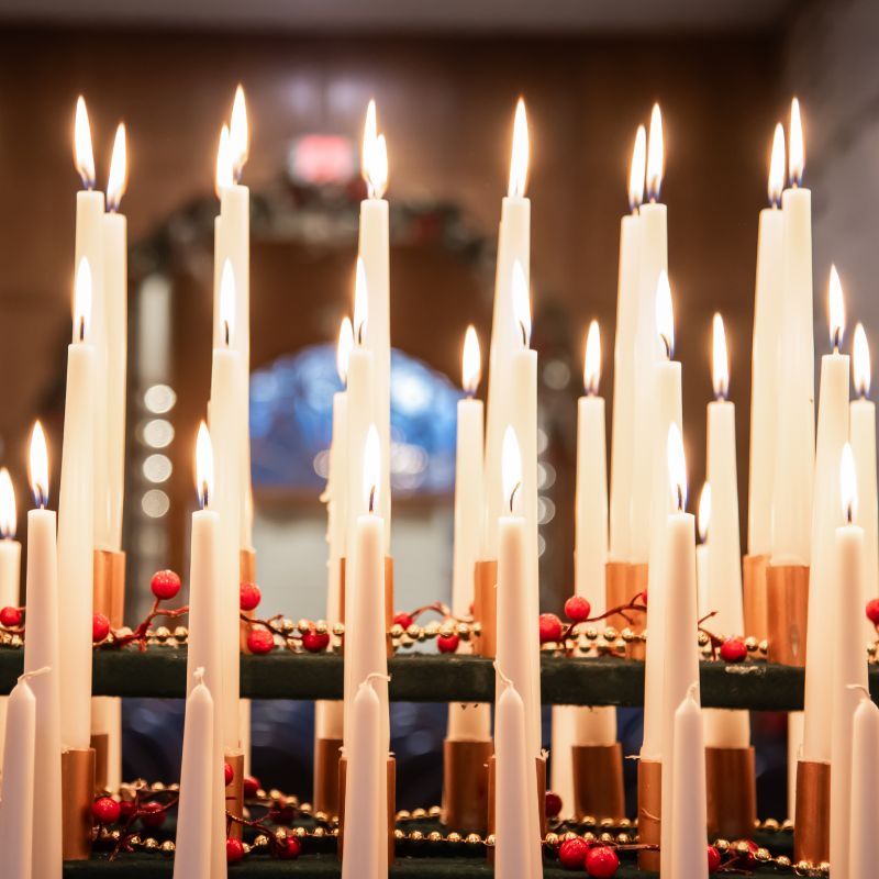 December photo by Kathy Danner of Christmas decorated candles
