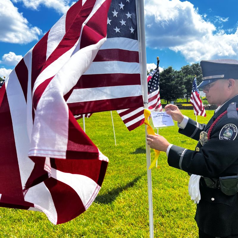 May Photo by Heather Jones of a solider holding an American flag